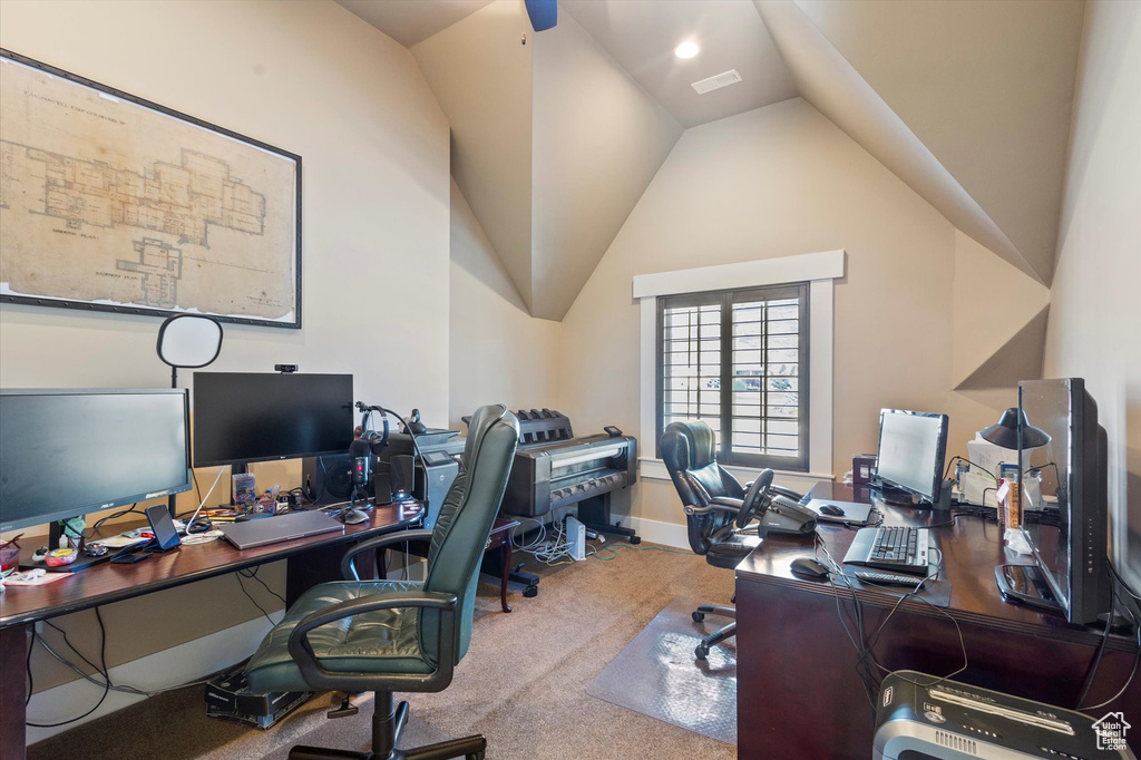 Office featuring carpet floors and vaulted ceiling