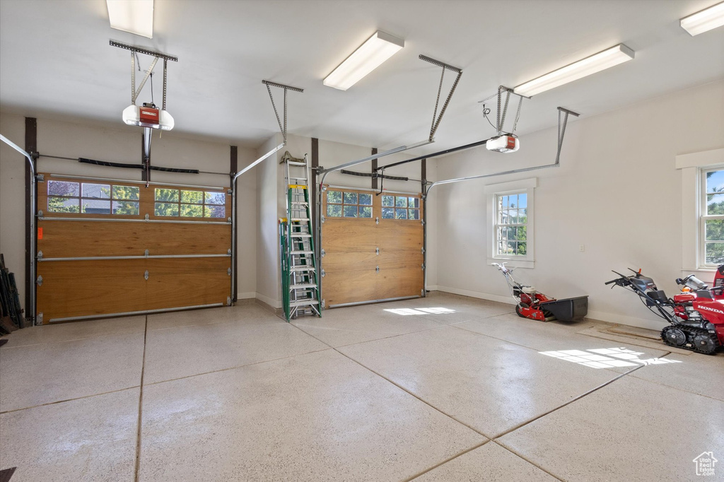 Garage featuring a garage door opener