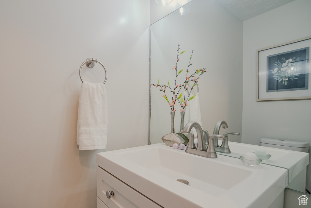 Bathroom with toilet and vanity