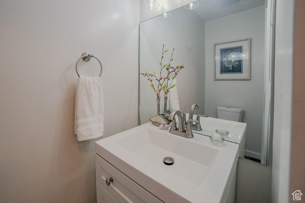 Bathroom with vanity and toilet