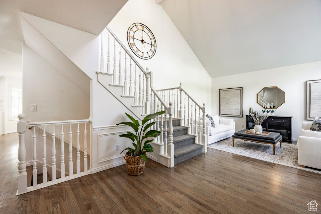 Interior space featuring high vaulted ceiling and hardwood / wood-style floors