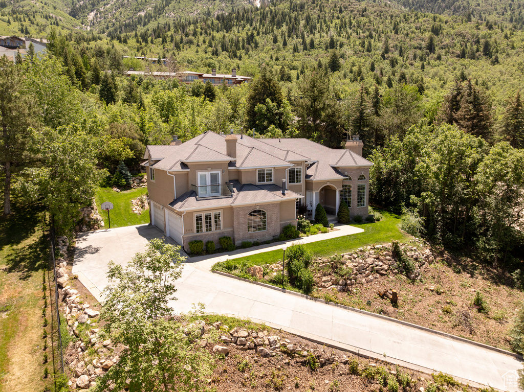 View of subject property featuring a forest
