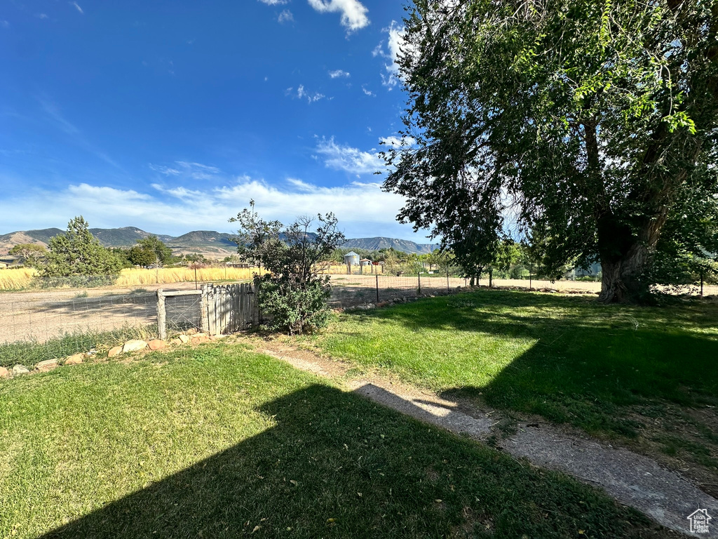 View of yard featuring a mountain view and a rural view