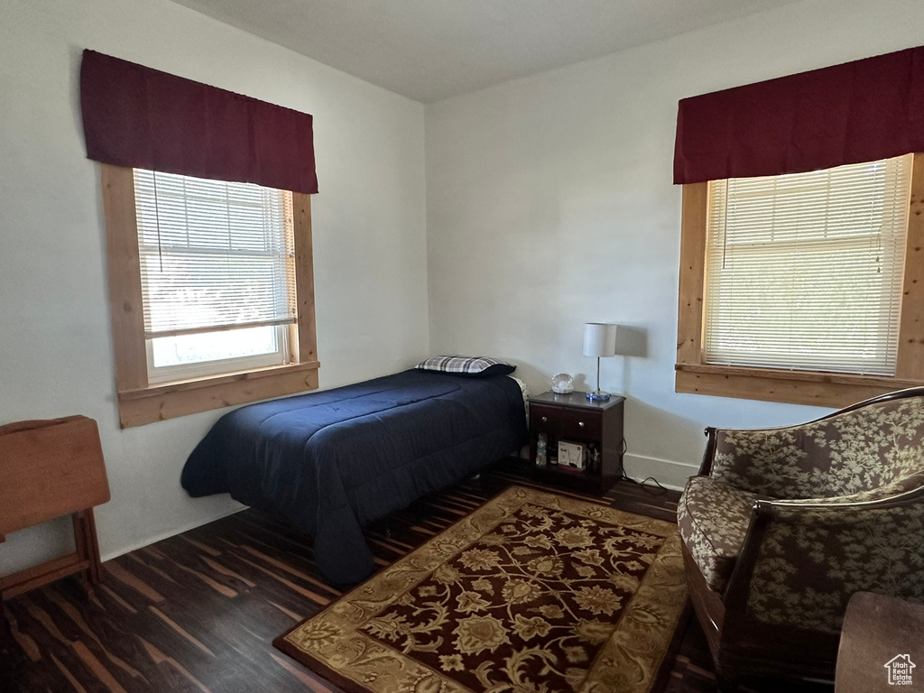 Bedroom featuring dark hardwood / wood-style flooring