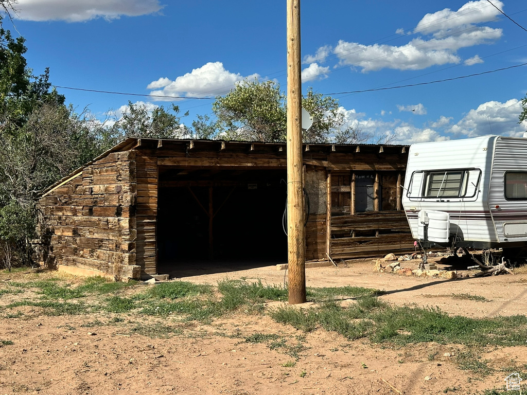 Rear view of house with an outbuilding