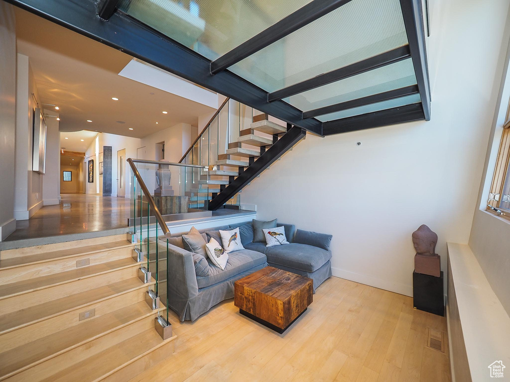 Staircase featuring hardwood / wood-style floors