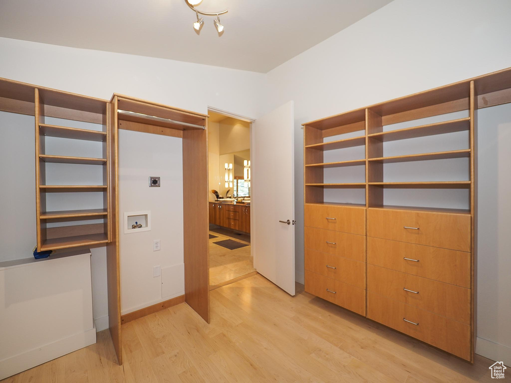 Interior space featuring light hardwood / wood-style flooring and lofted ceiling