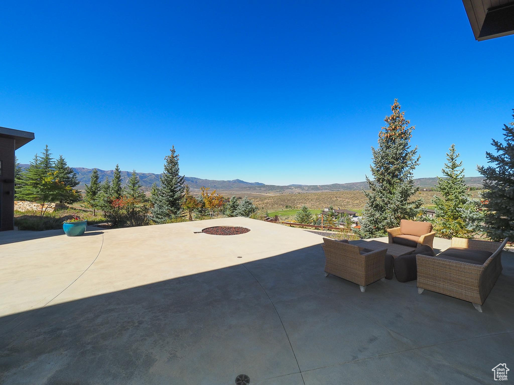 View of patio / terrace featuring an outdoor hangout area and a mountain view