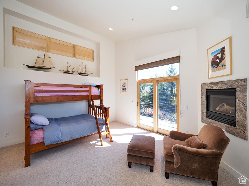 Bedroom featuring access to outside and light carpet