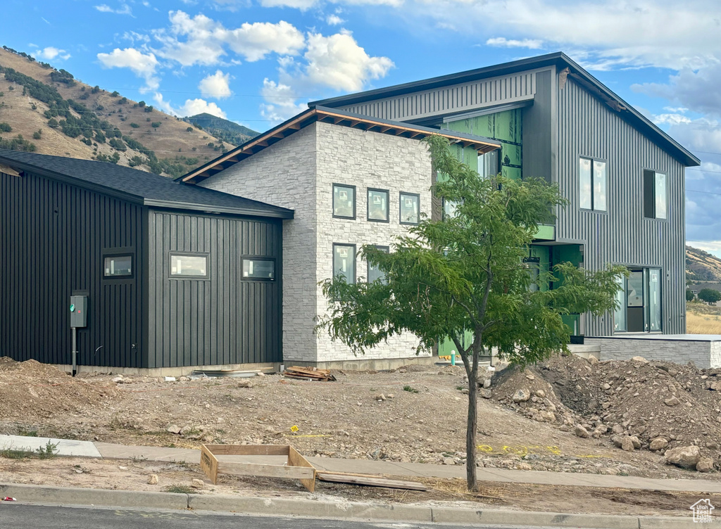 View of property exterior with a mountain view