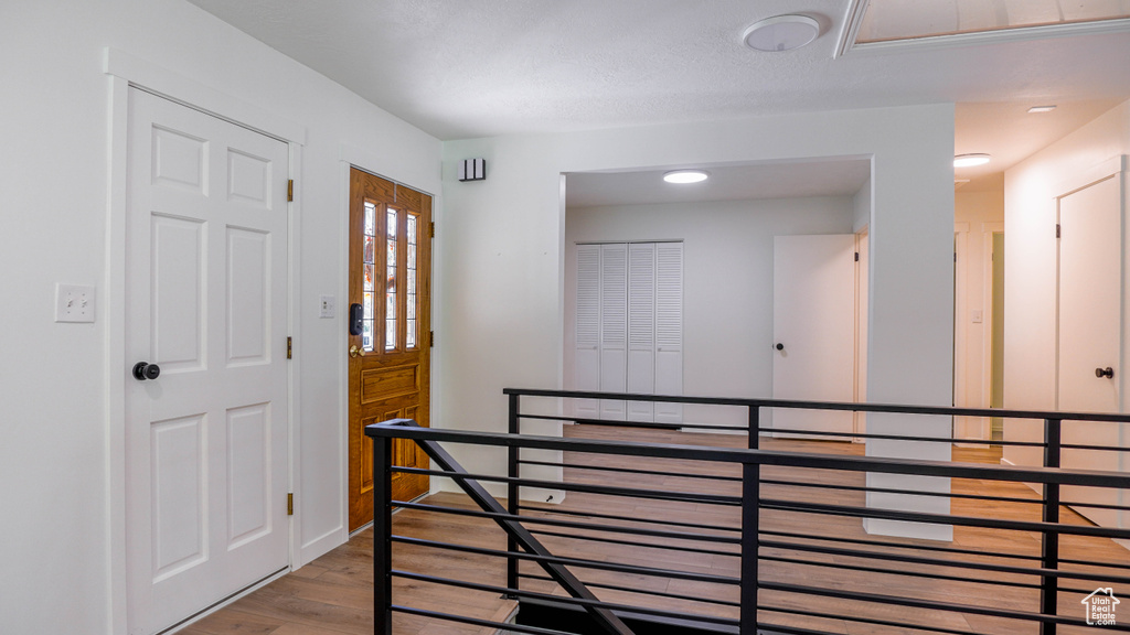 Entrance foyer featuring hardwood / wood-style flooring