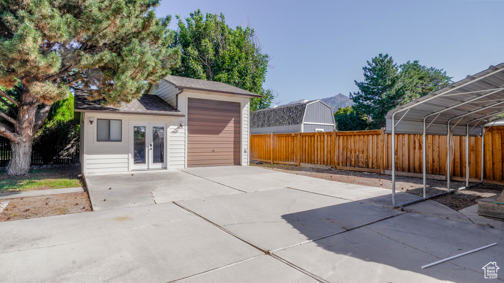 View of patio / terrace with a carport