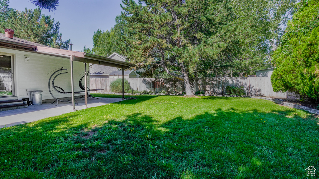 View of yard with a patio