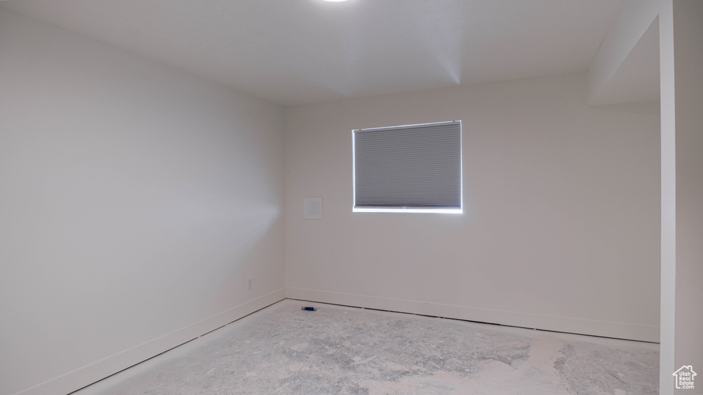 Unfurnished room with concrete floors