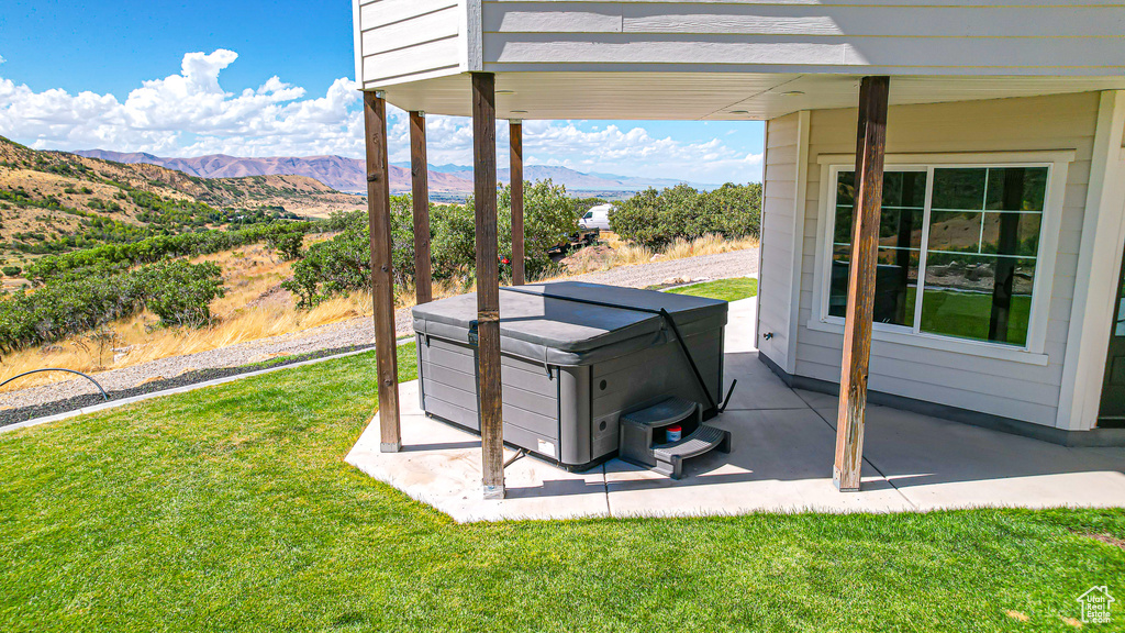 Exterior space with a mountain view and a patio area