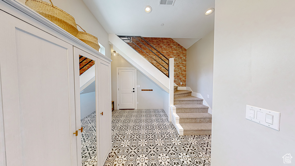 Stairway featuring tile patterned flooring