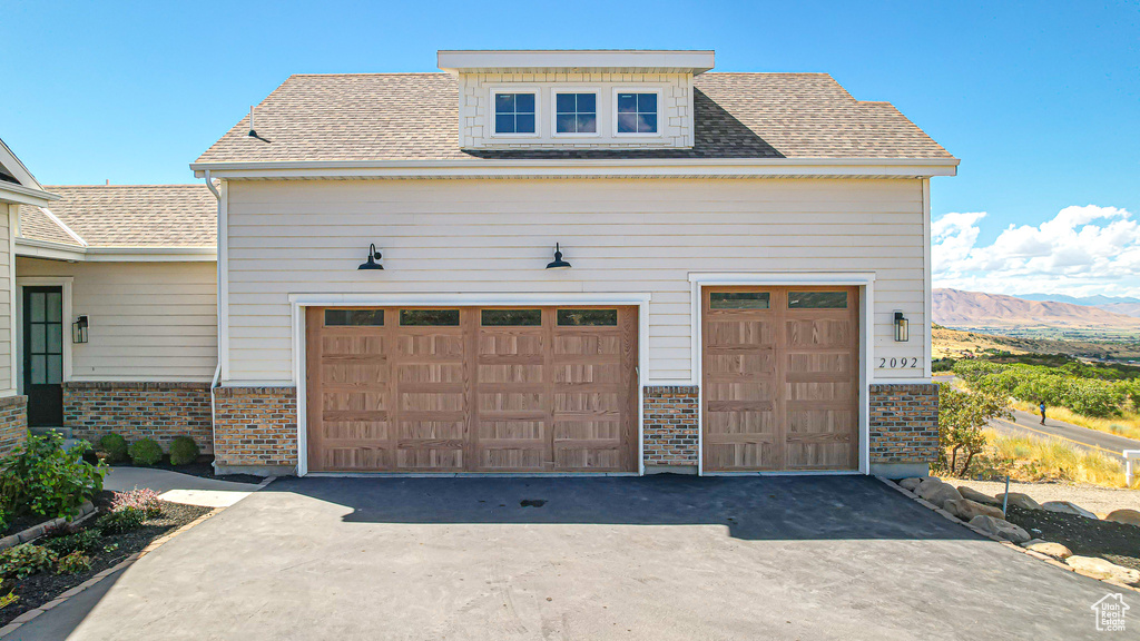 Garage featuring a mountain view