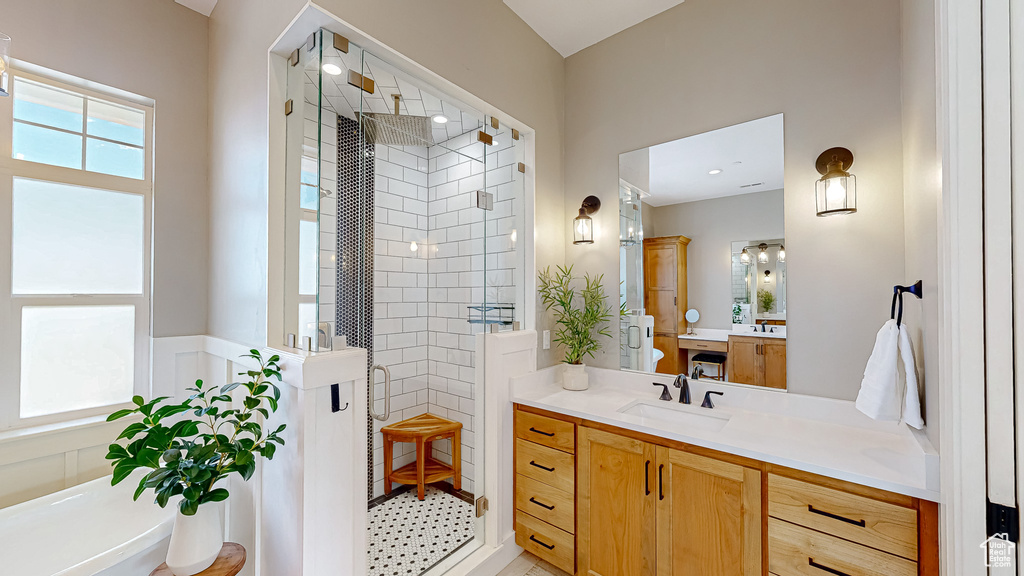 Bathroom with an enclosed shower and vanity