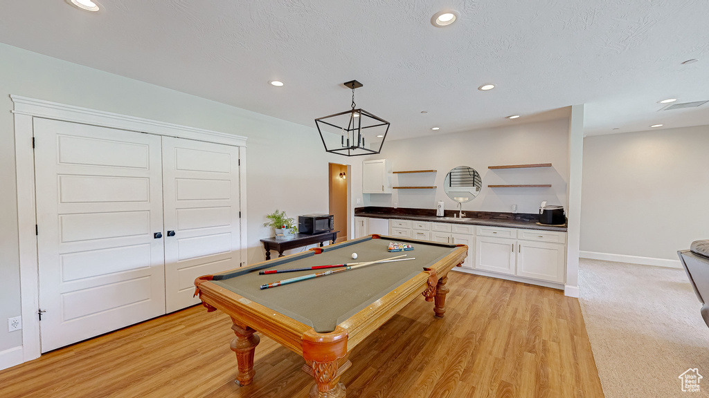 Rec room featuring sink, light colored carpet, and billiards