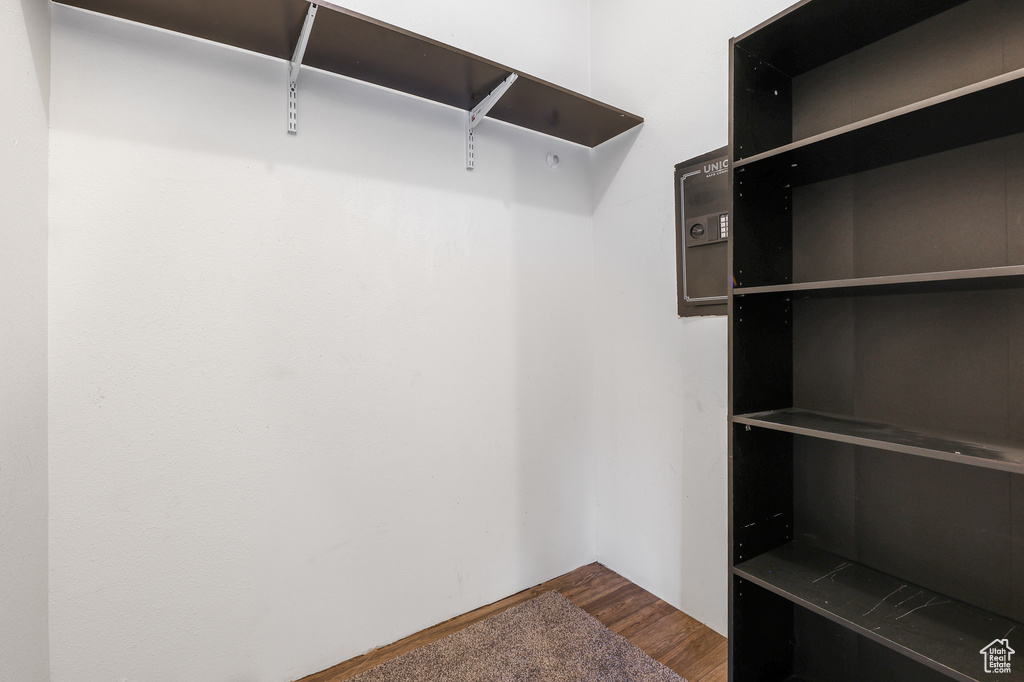 Walk in closet featuring hardwood / wood-style floors