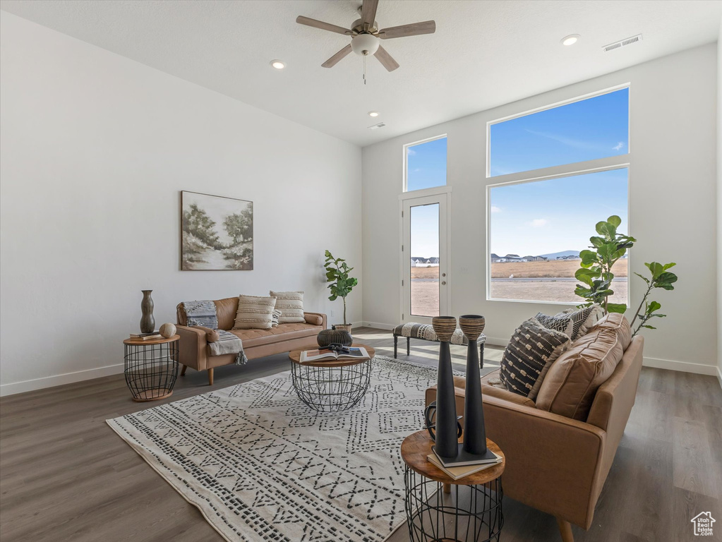 Living room featuring hardwood / wood-style floors and ceiling fan