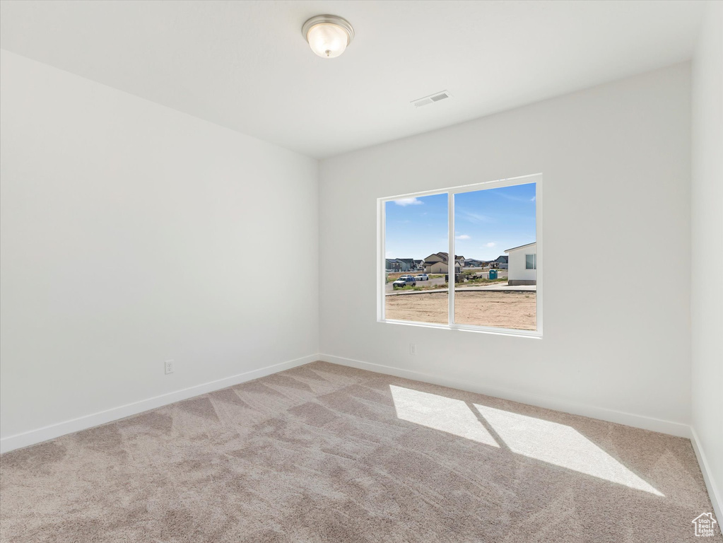 View of carpeted spare room