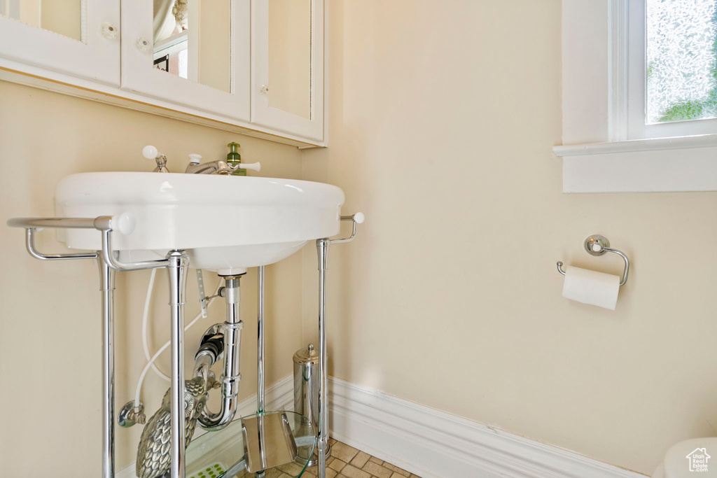 Bathroom featuring toilet and tile patterned floors