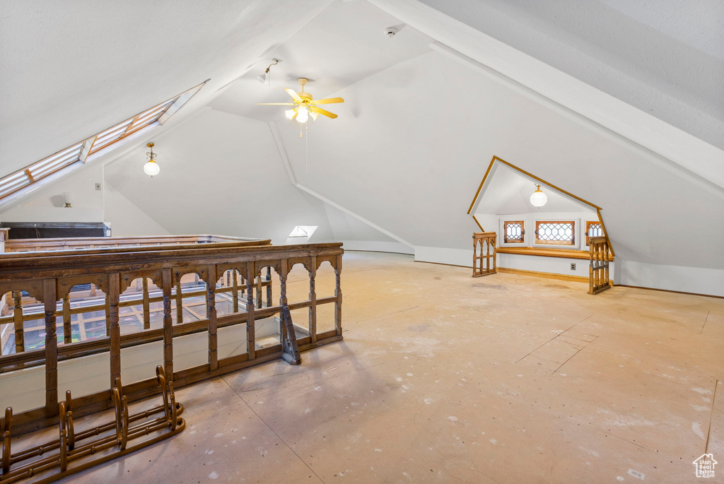 Bonus room featuring ceiling fan and lofted ceiling