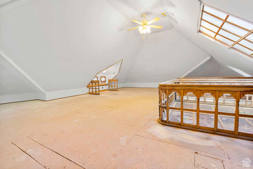 Additional living space featuring ceiling fan and lofted ceiling