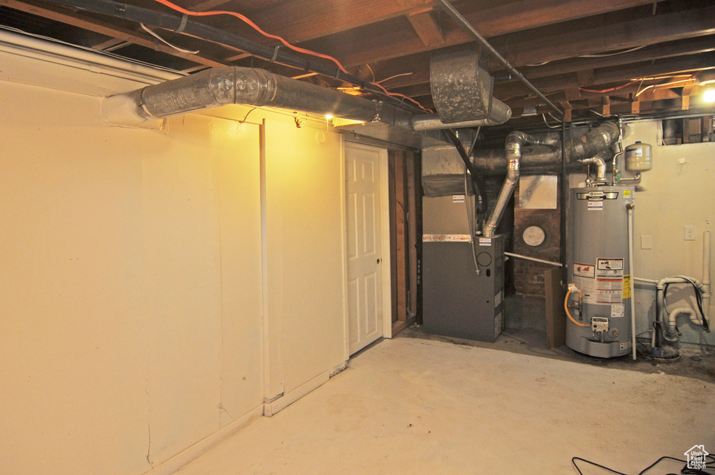 Basement with gas water heater and heating unit