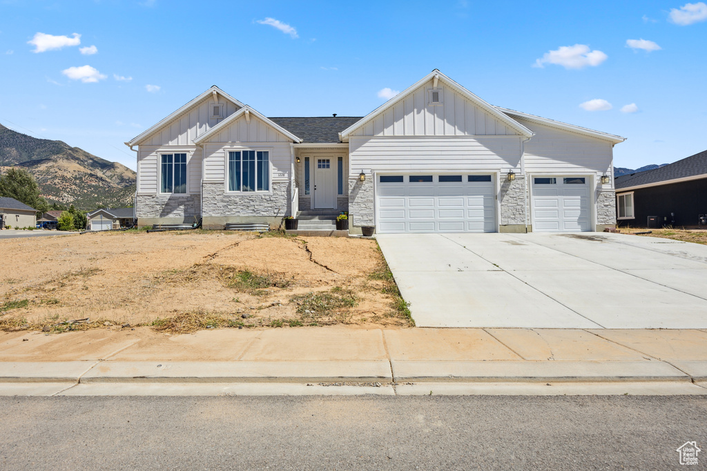 Craftsman-style home with a mountain view and a garage