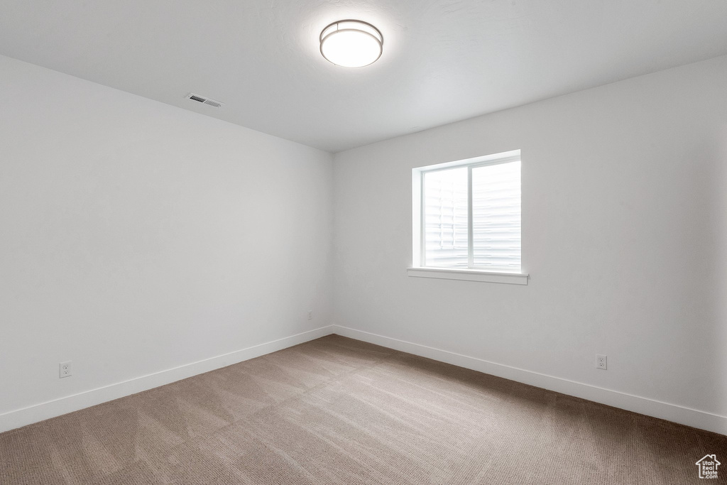 View of carpeted spare room