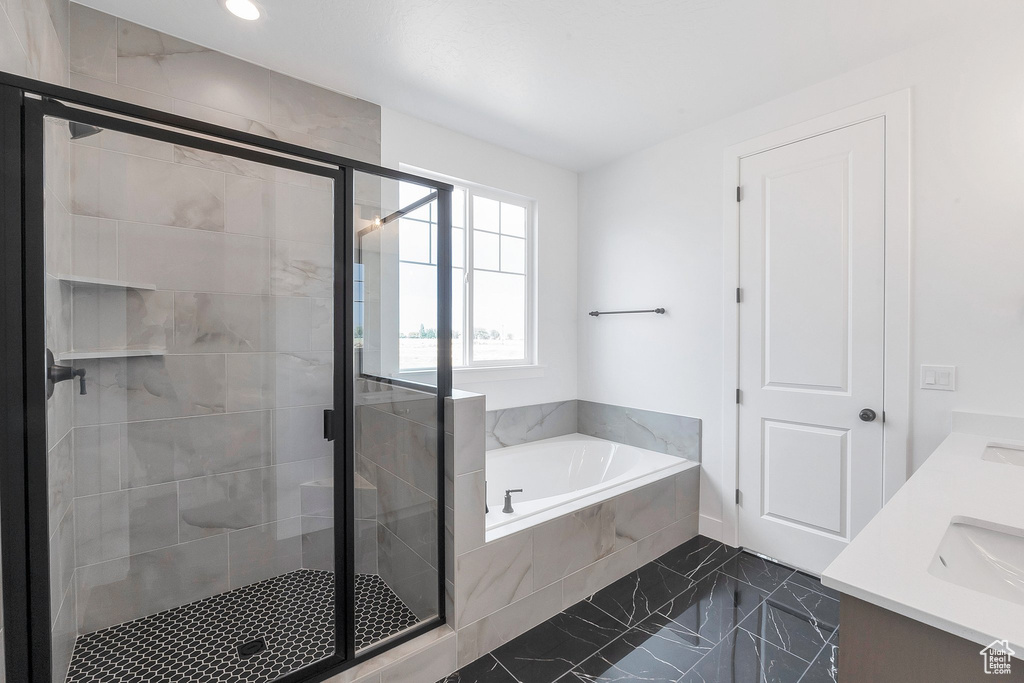 Bathroom with vanity and independent shower and bath