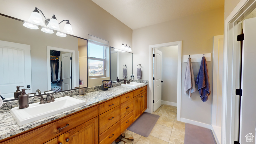 Bathroom with tile patterned flooring and vanity