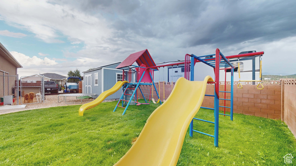 View of play area featuring a yard