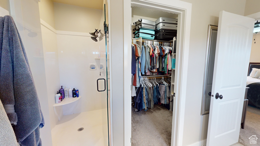 Bathroom with a shower with door