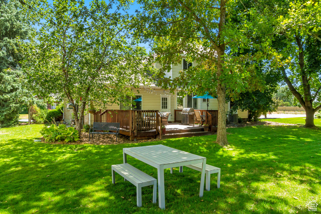 View of yard with a deck