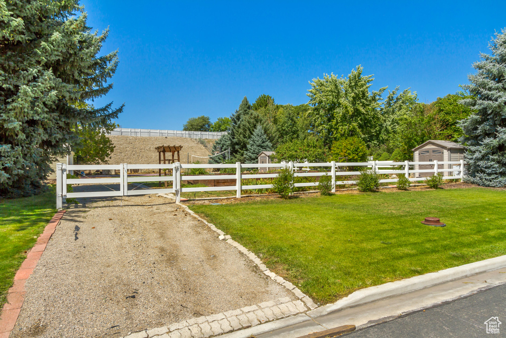 View of gate featuring a yard