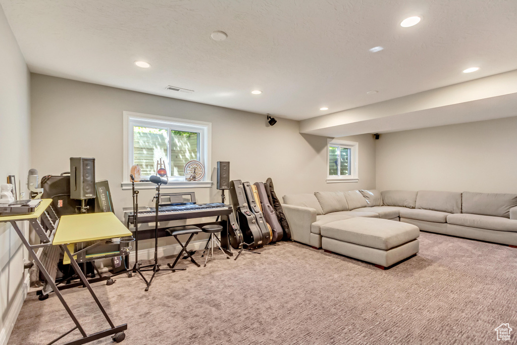 Living room featuring light carpet and plenty of natural light