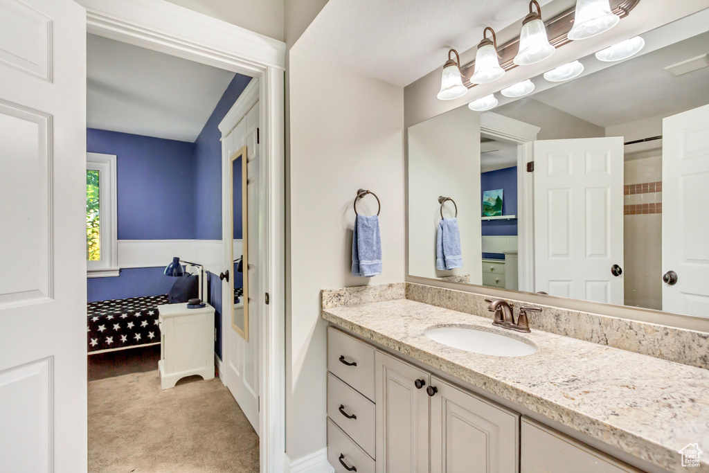 Bathroom featuring hardwood / wood-style flooring and vanity