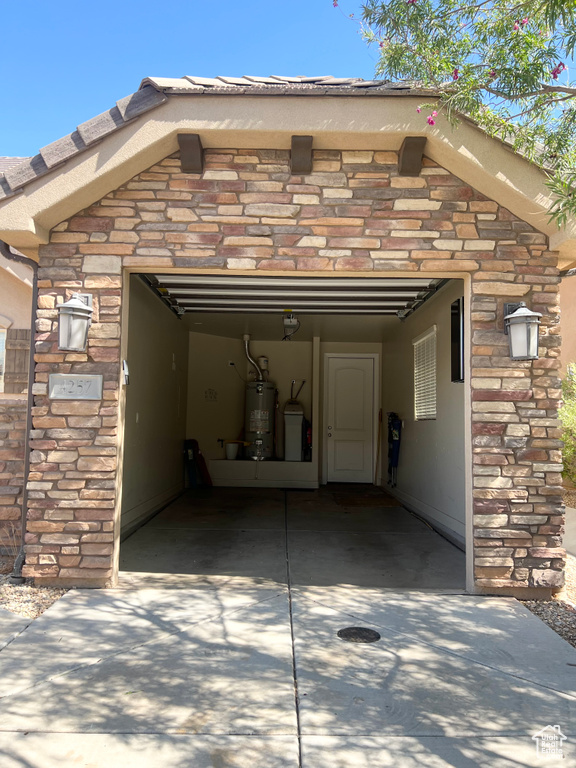 Garage featuring secured water heater