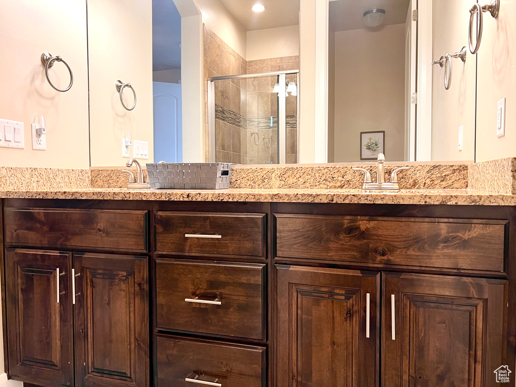 Bathroom featuring vanity and walk in shower