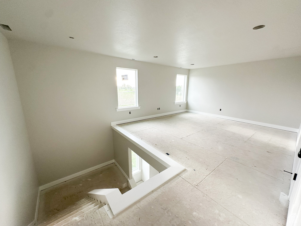Spare room featuring baseboards