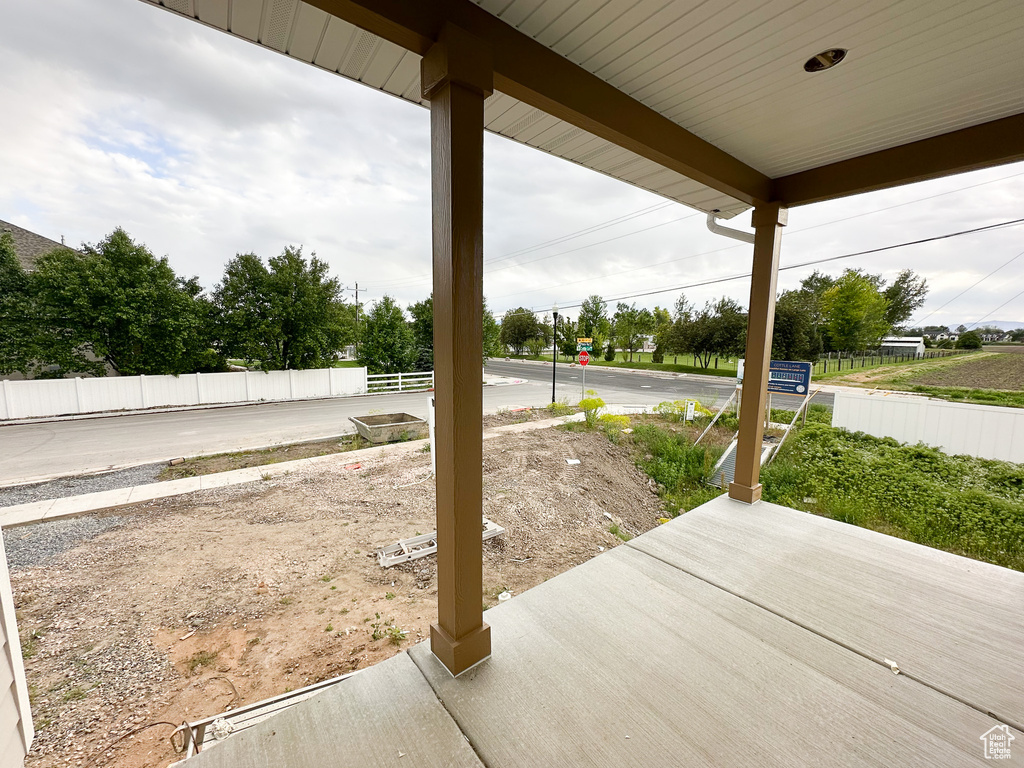 View of patio with fence
