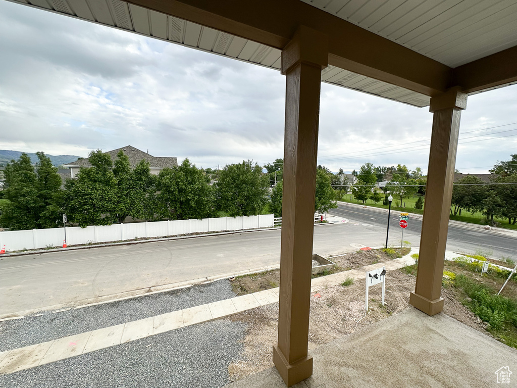 View of patio featuring fence