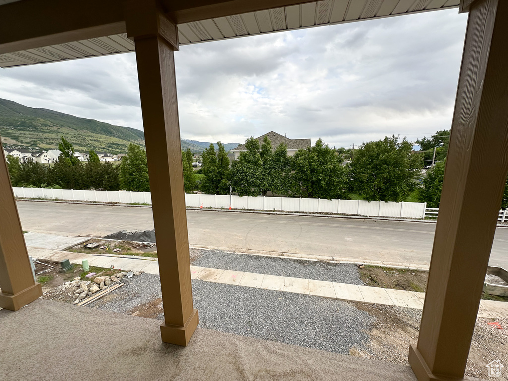 View of patio / terrace featuring a mountain view and fence