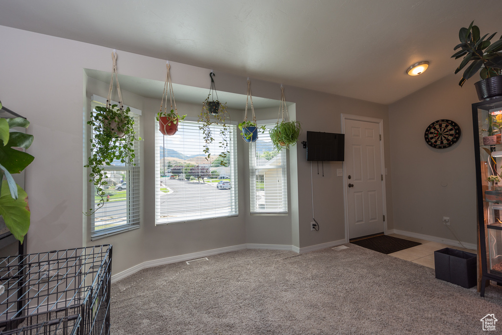 Unfurnished living room with carpet flooring