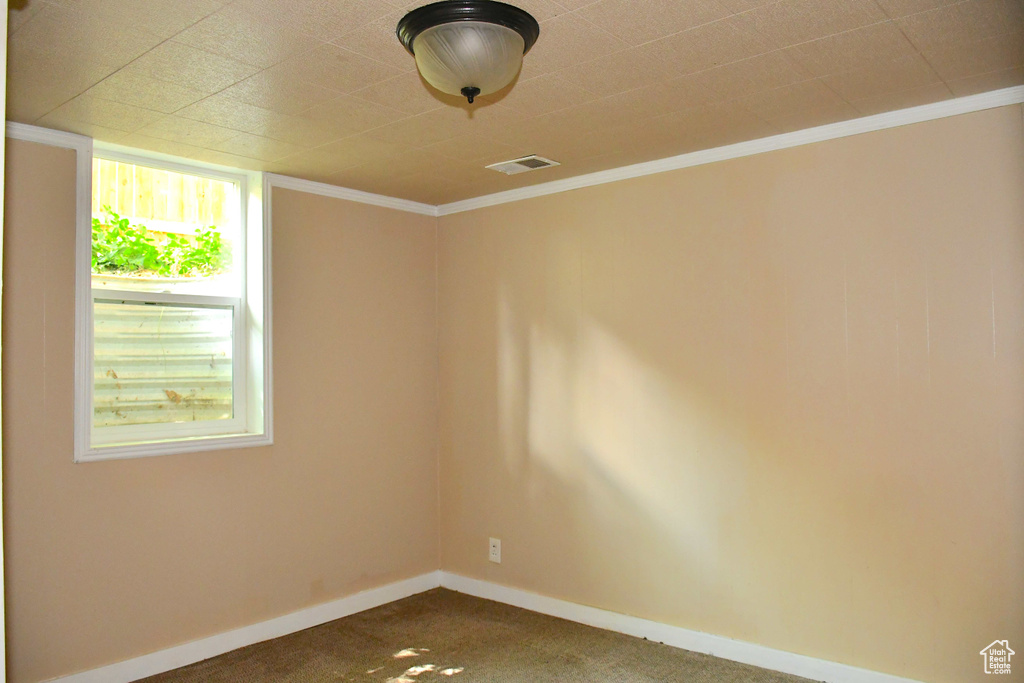 Empty room featuring carpet flooring