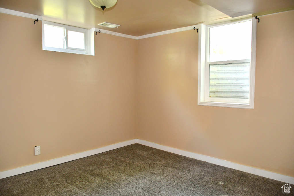 Empty room with carpet floors and ornamental molding