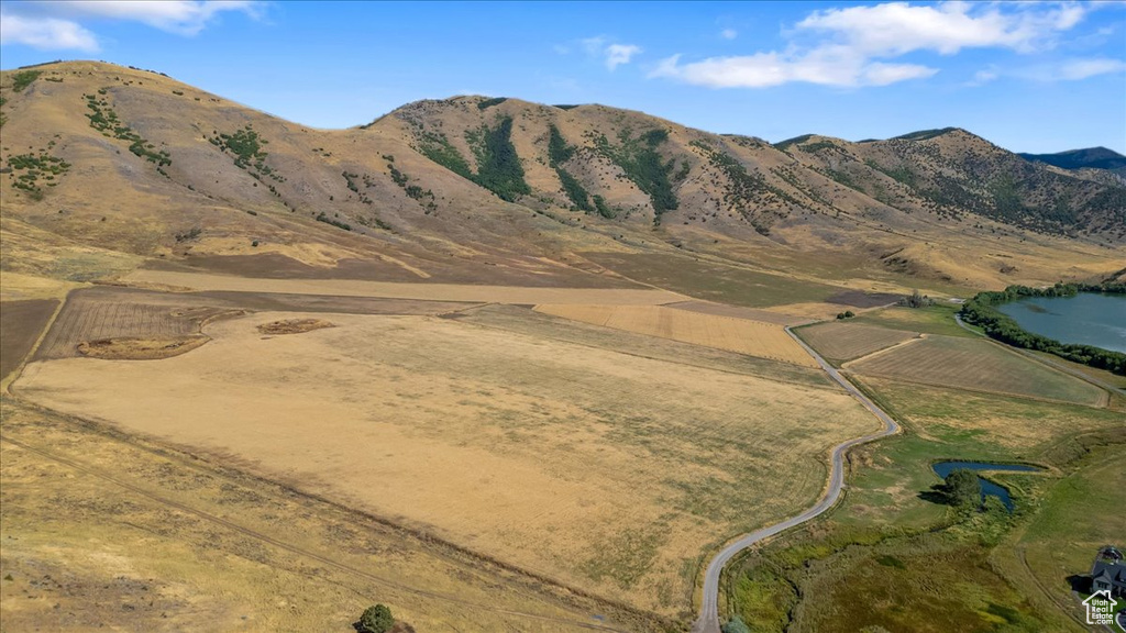 Property view of mountains with a rural view